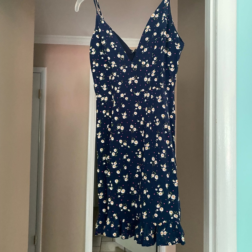 FLORAL NAVY DRESS ABOUT US